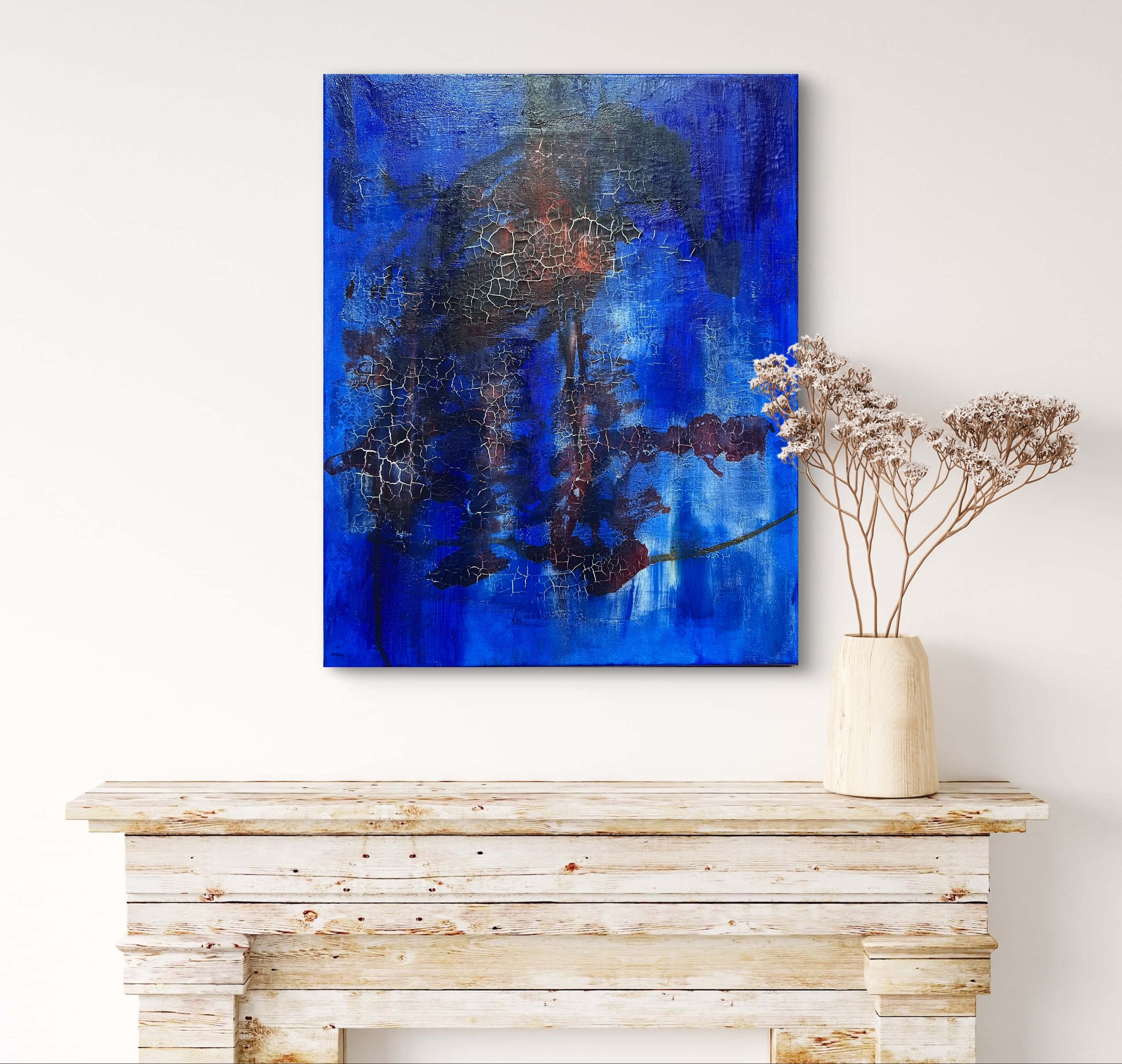 Fractured Echoes, is an oil and acrylic Ink abstract painting by Beatrice Morel. This painting is a hauntingly beautiful exploration of time, memory, and transformation. Featuring deep, moody blues that dominate the canvas, creating an almost infinite expanse that feels like the depths of the ocean or the vastness of a twilight sky. Against this backdrop, fiery reds and earthy browns emerge, their forms fractured and disrupted, as if something once whole has begun to break apart and decay. Above a fireplace