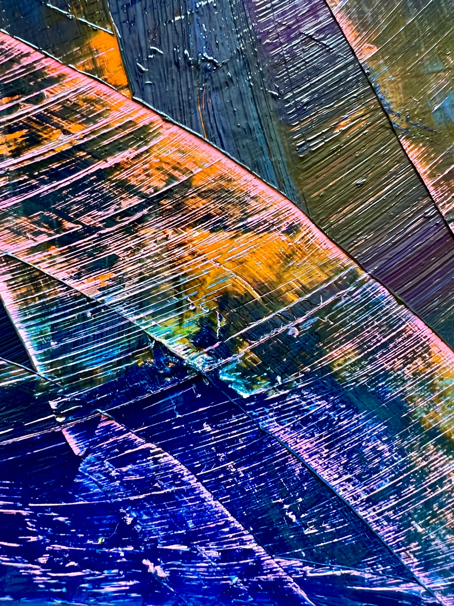 No Roots is an oil based abstract painting by Beatrice Morel, dominated by varying shades of blue, from the deepest indigo to the softest cerulean. Geometric figures emerge from the depths of the azure expanse. This is a close up.