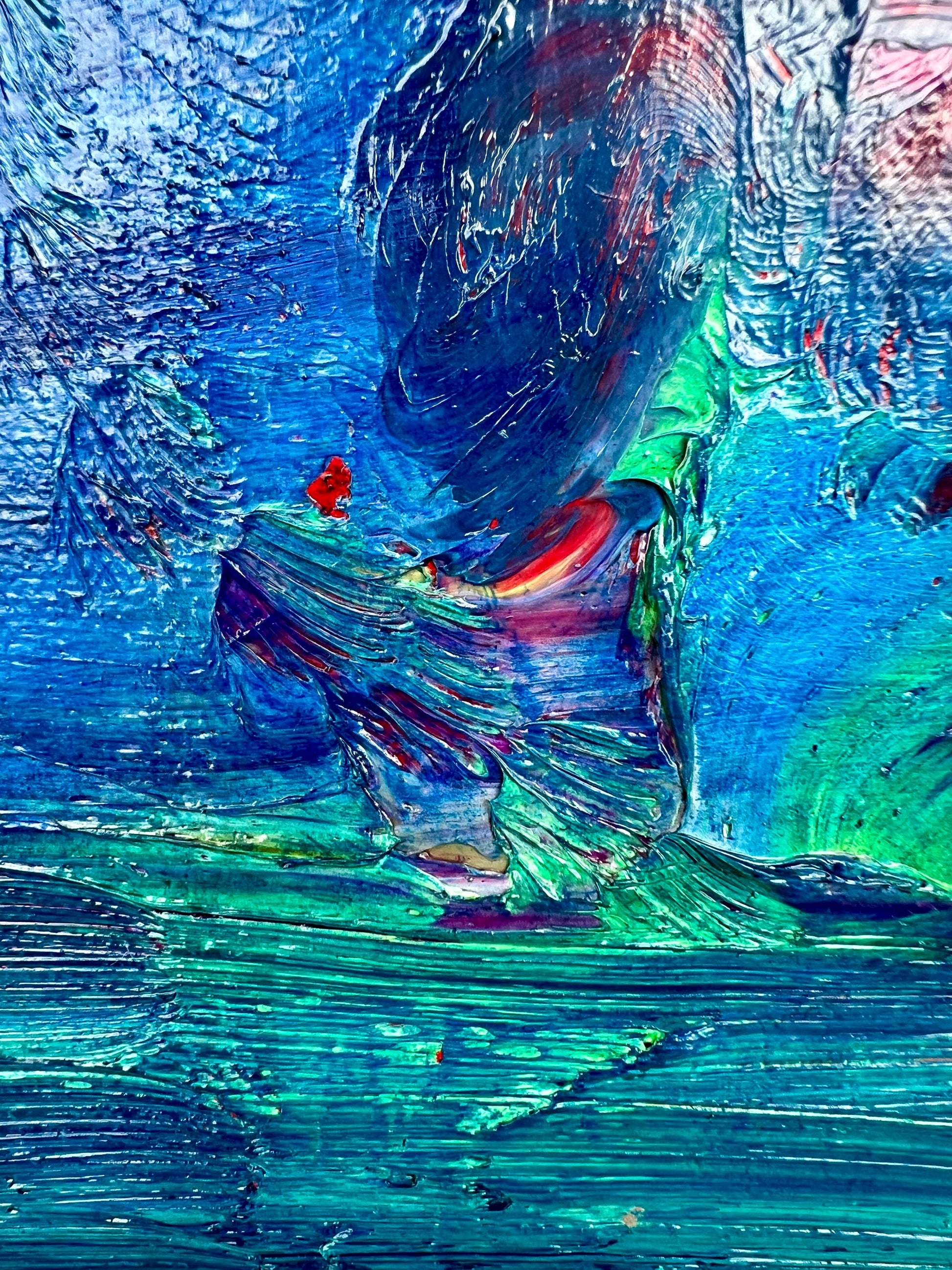 Rise and Fall An oil based abstract painting Beatrice Morel featuring various shades of blue. In the heart of the painting, a mesmerizing interplay of red and yellow emerges, forming the focal point of the composition. This is a close up