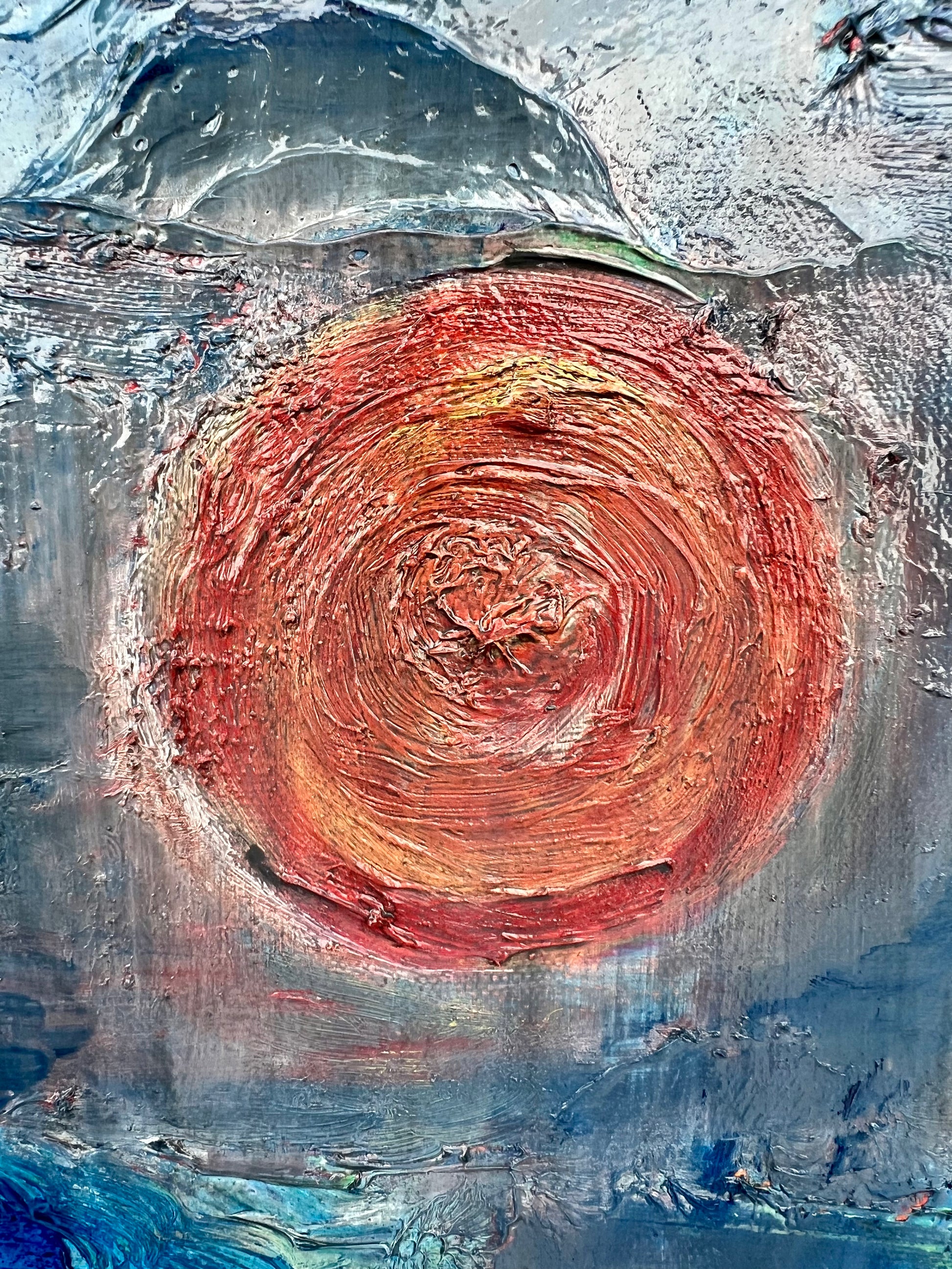 Rise and Fall An oil based abstract painting Beatrice Morel featuring various shades of blue. In the heart of the painting, a mesmerizing interplay of red and yellow emerges, forming the focal point of the composition. This is a close up of the red and yellow.